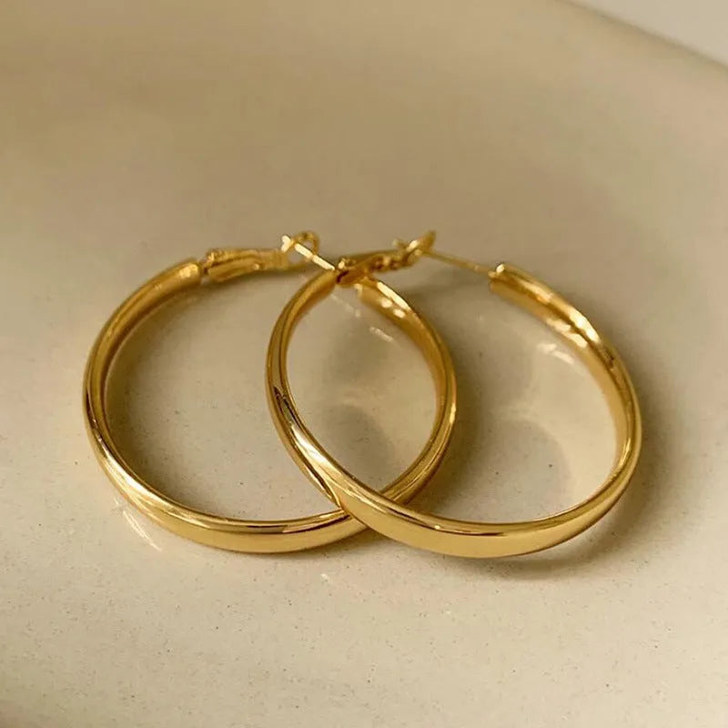 40mm circular metal earrings with gold or silver electroplated finish on copper