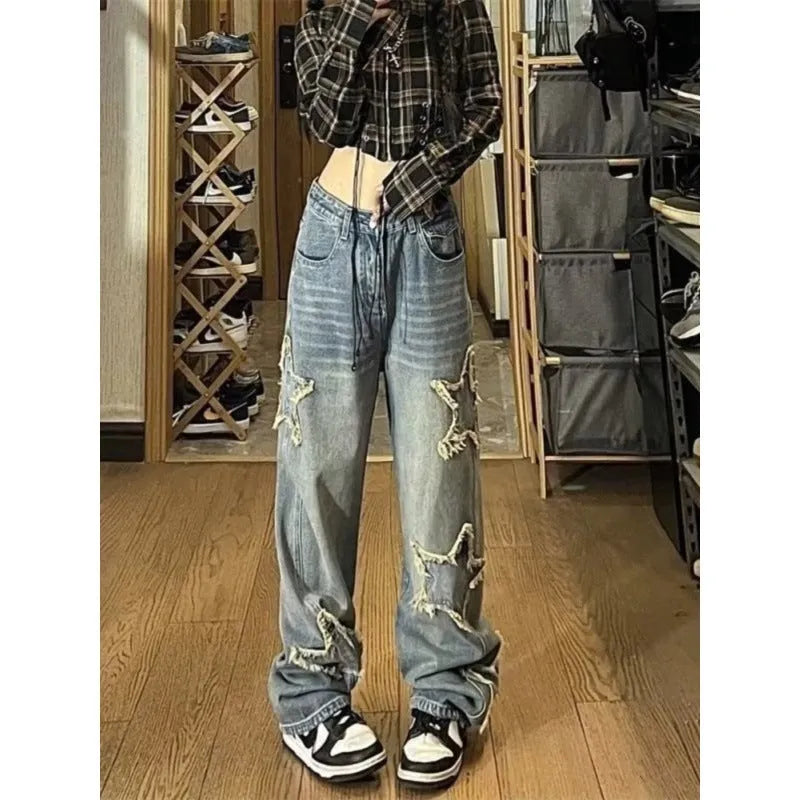 Blue women's straight-leg jeans with a high waist on a neutral background.
