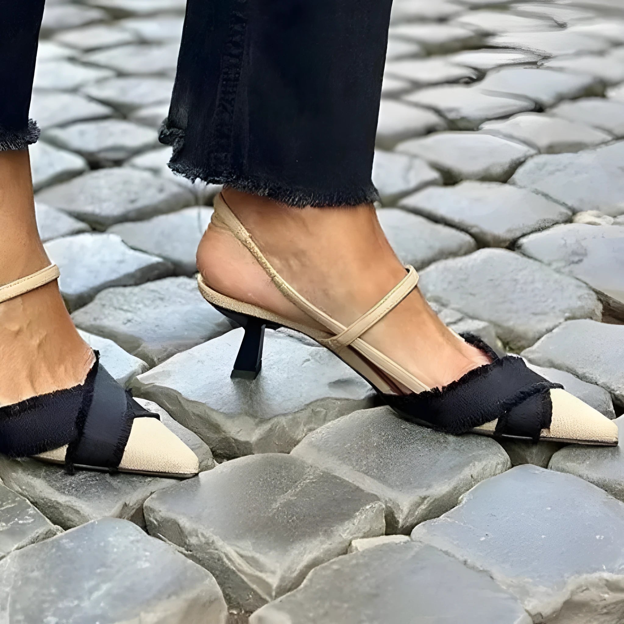 Women's apricot and black colour block stiletto sandals with pointed toe and buckle strap.