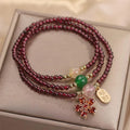 Women's natural crystal bracelet in pomegranate red cherry blossom colour with sequin accents