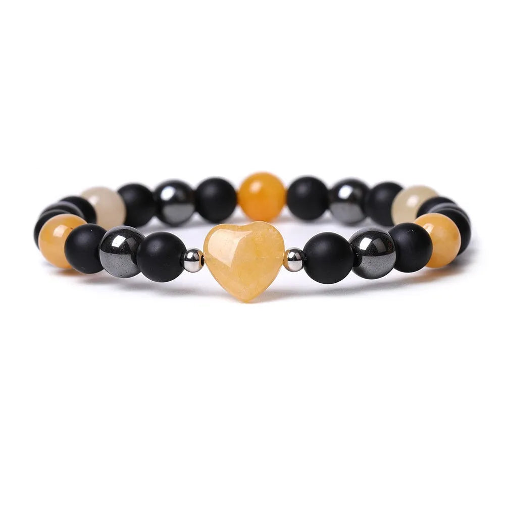 Hand-cut geometric peach heart stone bracelet with moon symbols in tigereye colour