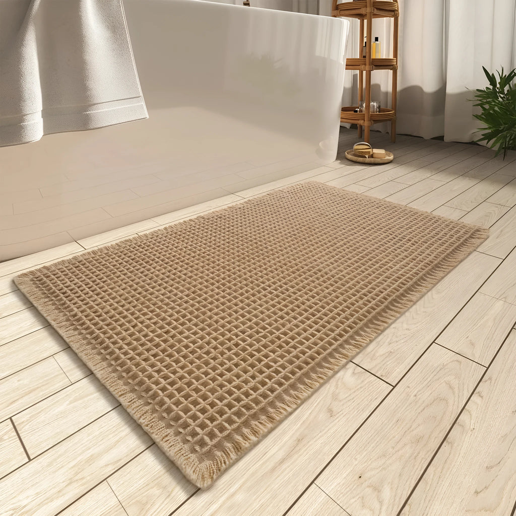 Square checkered pattern non-slip bathroom carpet on tiled floor in beige colour.