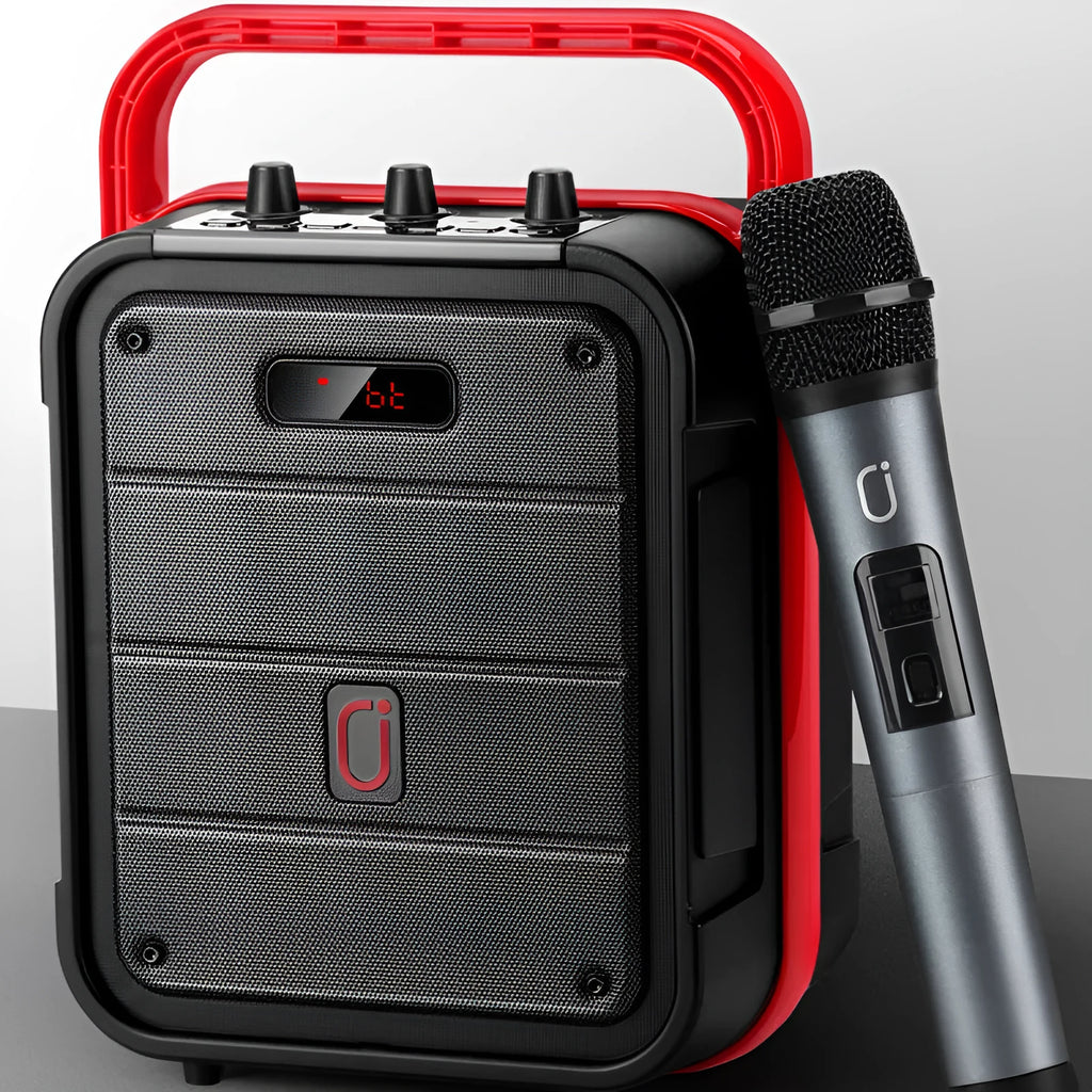 MS62AI black portable Bluetooth speaker with wireless microphone and remote control on a table.