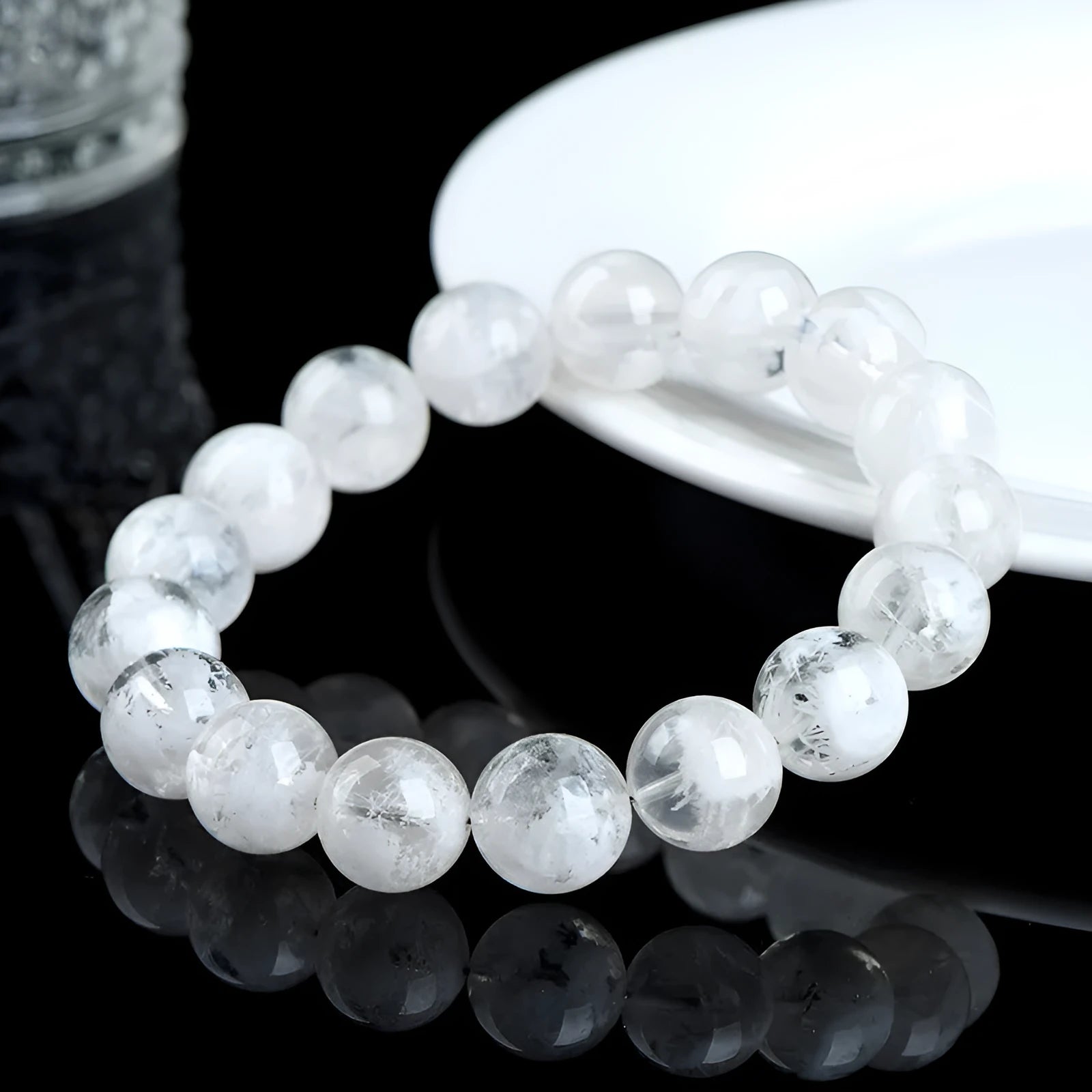 Women's crystal bracelet with round snowflake beads and a traditional Ruyi charm.