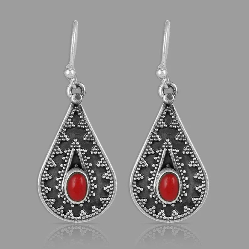 Silver drop earrings with a red pine gemstone in a retro zinc alloy setting.