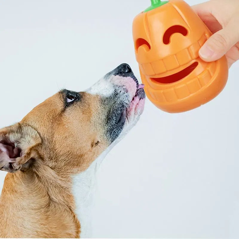 Yellow pumpkin-shaped dog chew toy made from TPR material measuring 8.6x11.5cm