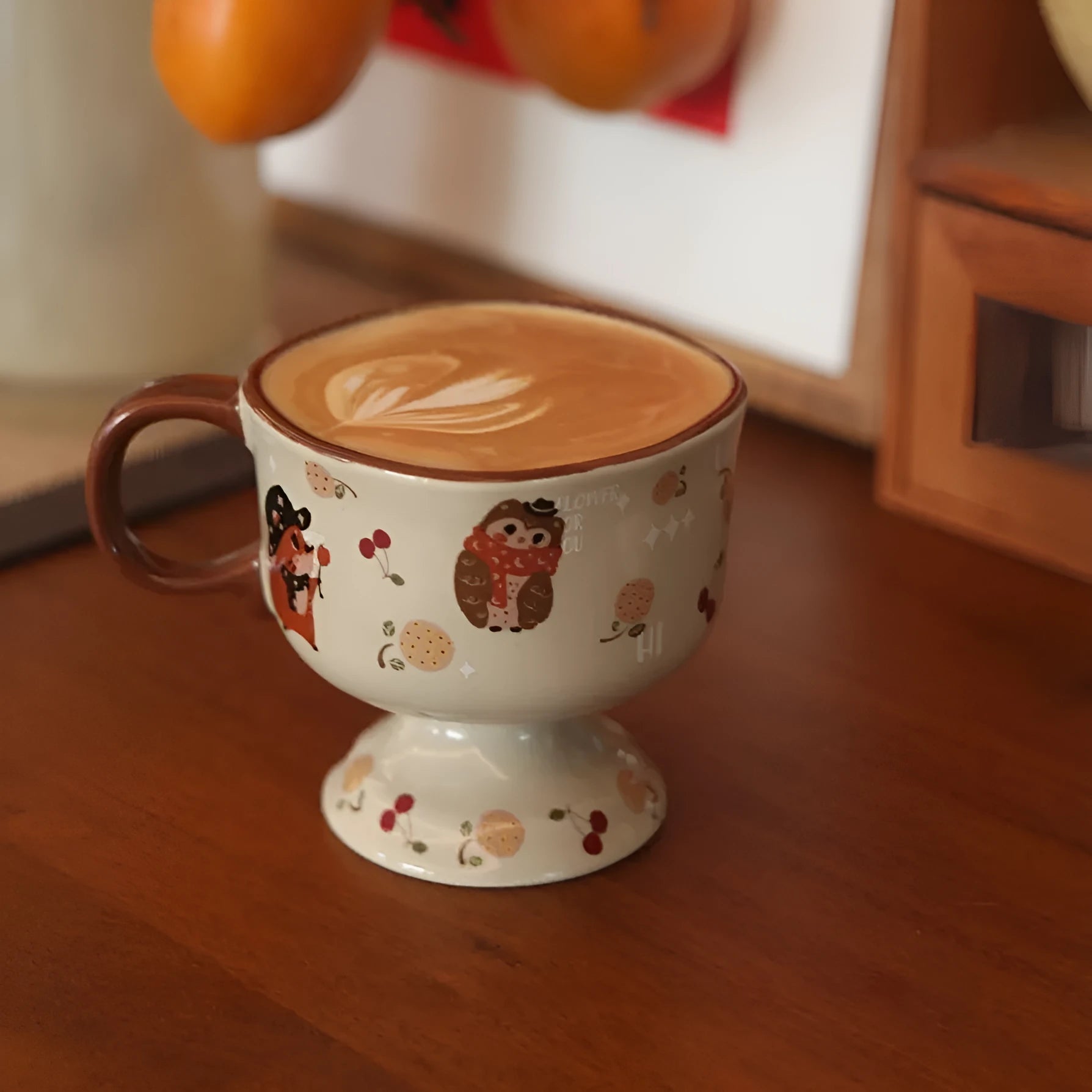 Antique caramel ceramic goblet with saucer featuring a beaming cat cartoon pattern in Autumn Squirrel colour, 250ml capacity
