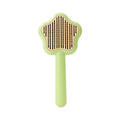 Green self-cleaning stainless steel magic wand cat comb on a white background.