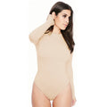 A woman wearing a high-elasticity apricot-coloured shorts jumpsuit, demonstrating the mid-waist fit and casual style.