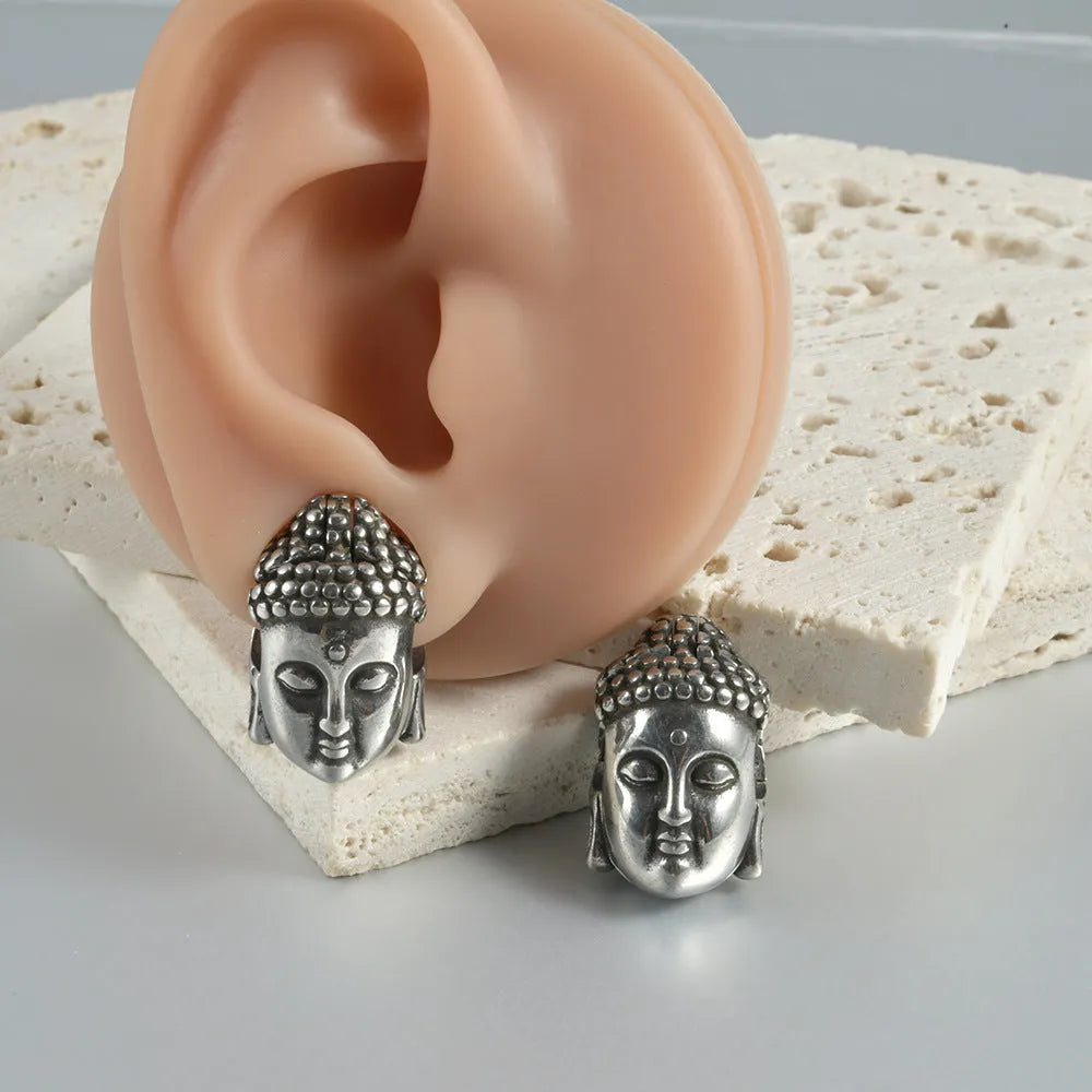 Stainless steel hollow skull and Buddha geometric earrings in electroplated colours.