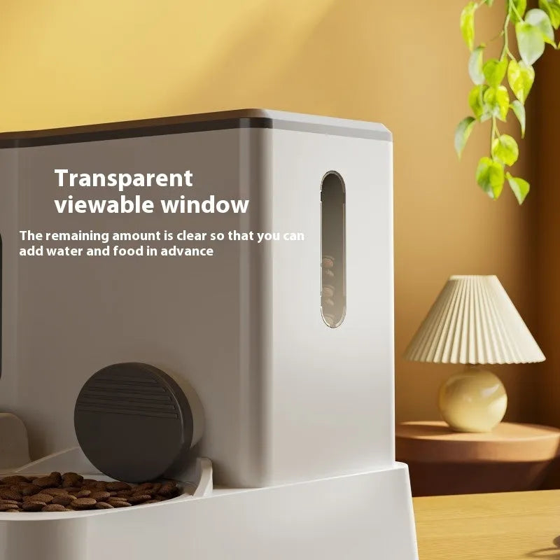 Automatic cat feeder with integrated water dispenser showing dual bowl design for food and water
