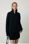 Wool bandage dress with loose lapels and long sleeves in black.