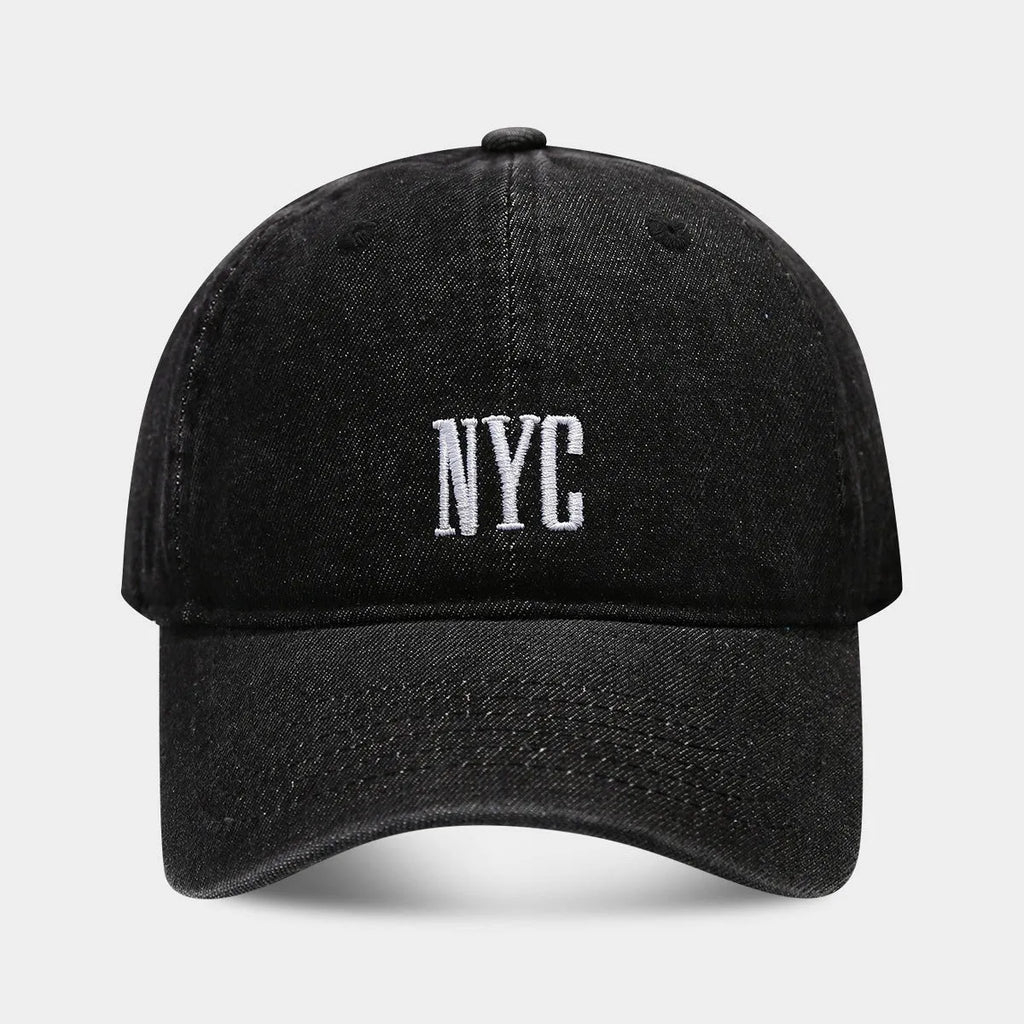 Retro denim peaked baseball cap with an alphabet letter, shown in light blue, dark blue, and black colours.