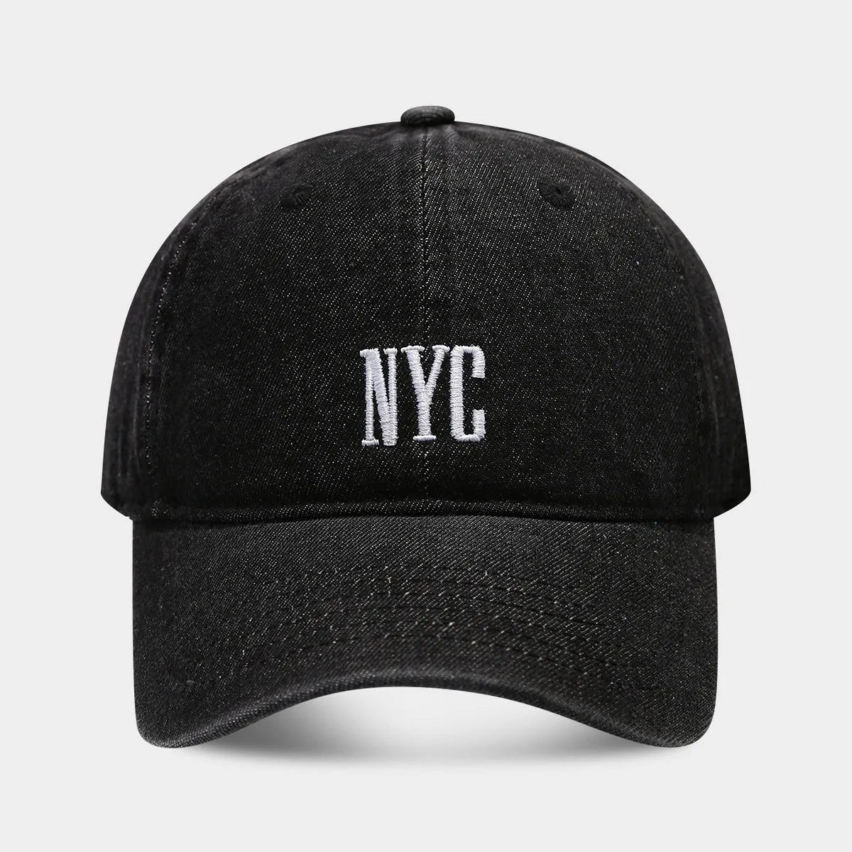 Retro denim peaked baseball cap with an alphabet letter, shown in light blue, dark blue, and black colours.