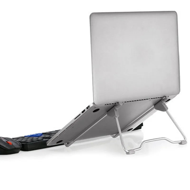 Grey aluminium alloy and plastic adjustable stand holding a mobile phone and a tablet on a desk.