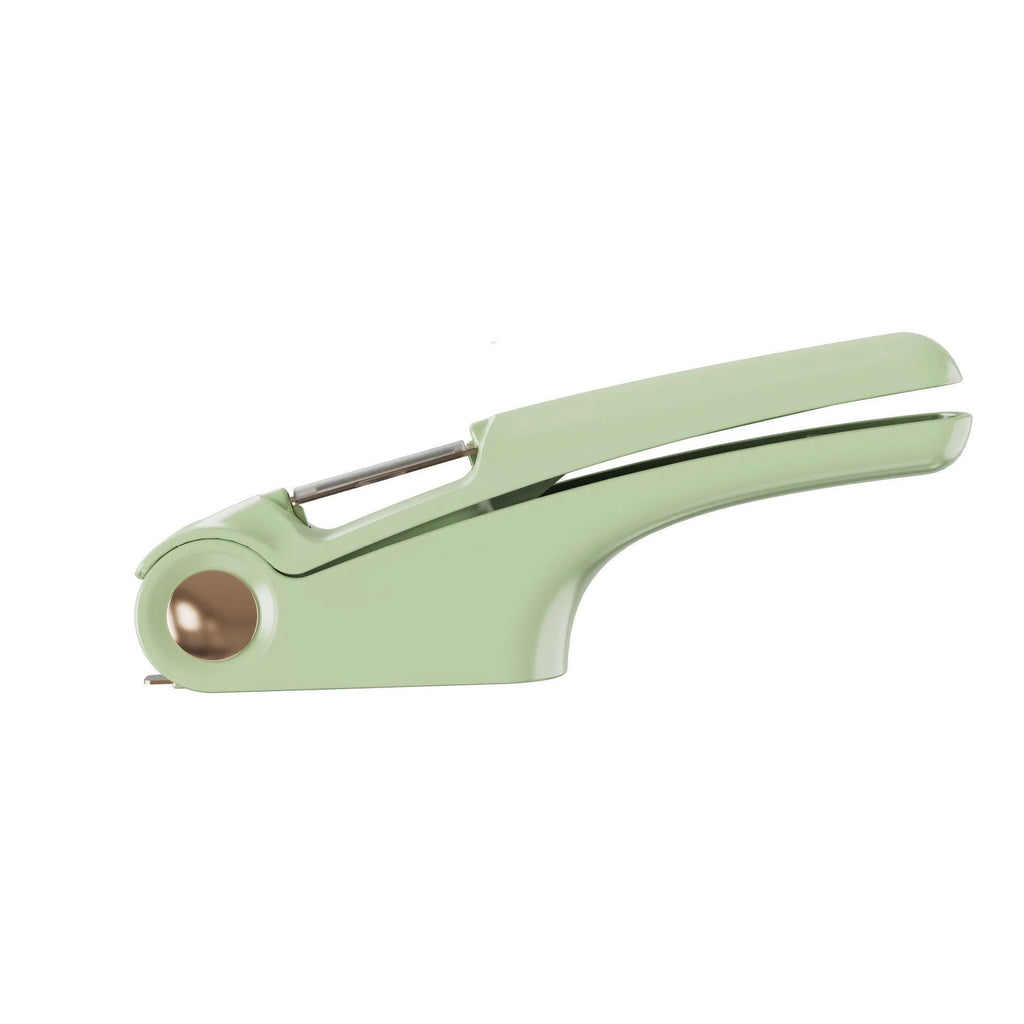 White manual garlic press made of ABS plastic and stainless steel on a kitchen counter.
