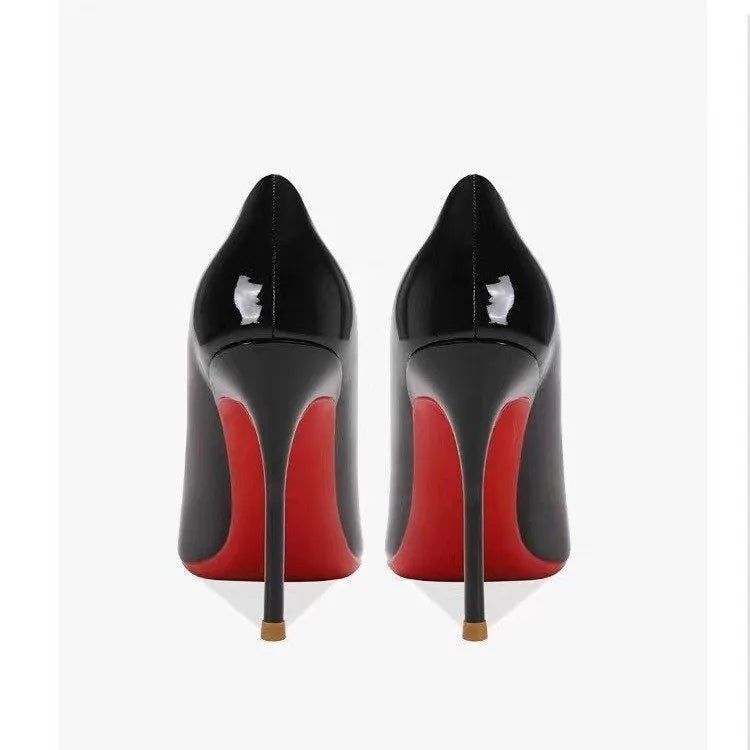 Women's pointed low-cut patent leather stiletto heels in black solid colour with stiletto heel and pointed toe