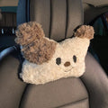 Puppy plush car headrest cushion and matching lumbar support pillow on a car seat.