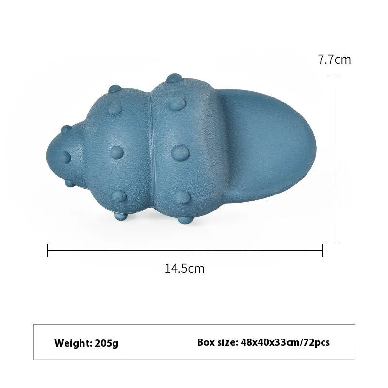 Blue and green shark-shaped rubber dog chew toy on a white background.