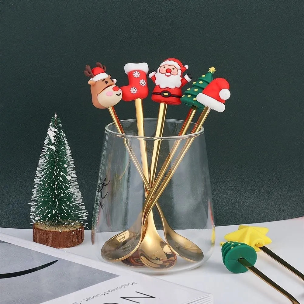 Red stainless steel Christmas spoon and fork set with tree and snowman patterns on handles