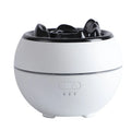 White and black ultrasonic aroma diffuser humidifier with round design and mechanical controls on a desk.