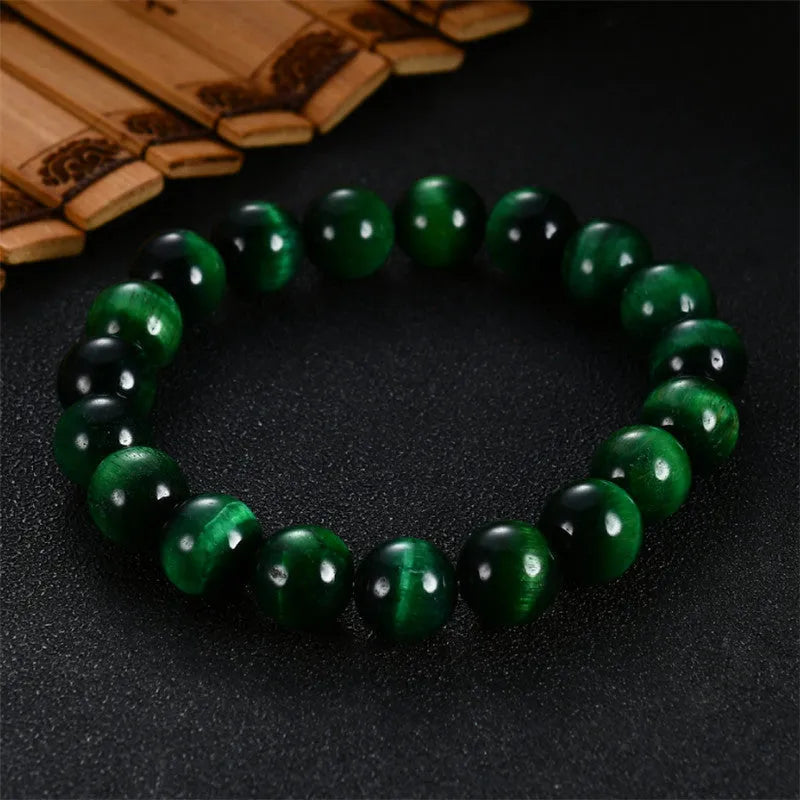 Green Tiger Eye stone bracelet with polished geometric beads in various sizes