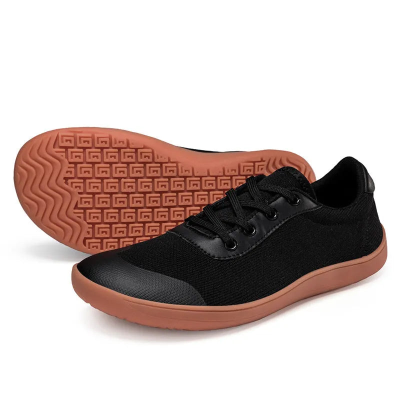 Men's low-top training shoe in a solid colour with a mesh upper and ribbed outsole, shown in a larger size.