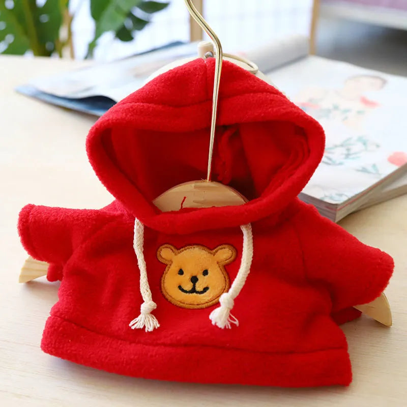 A dog wearing a soft cloth zip-up hoodie sweater in a choice of colours including a grey bear print.