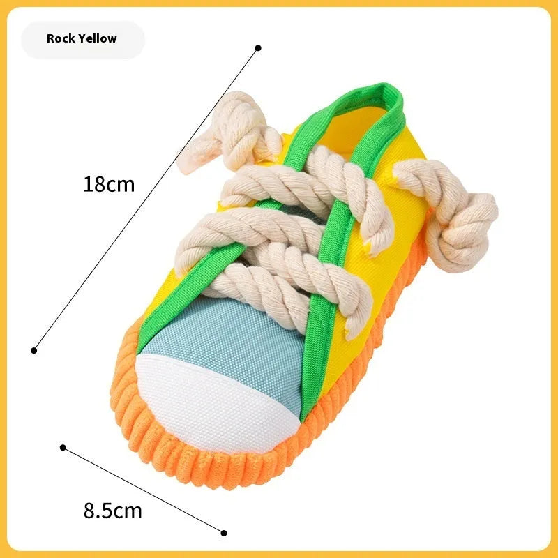 Plastic squeaky slipper-shaped dog chew toy in yellow, black, or blue.
