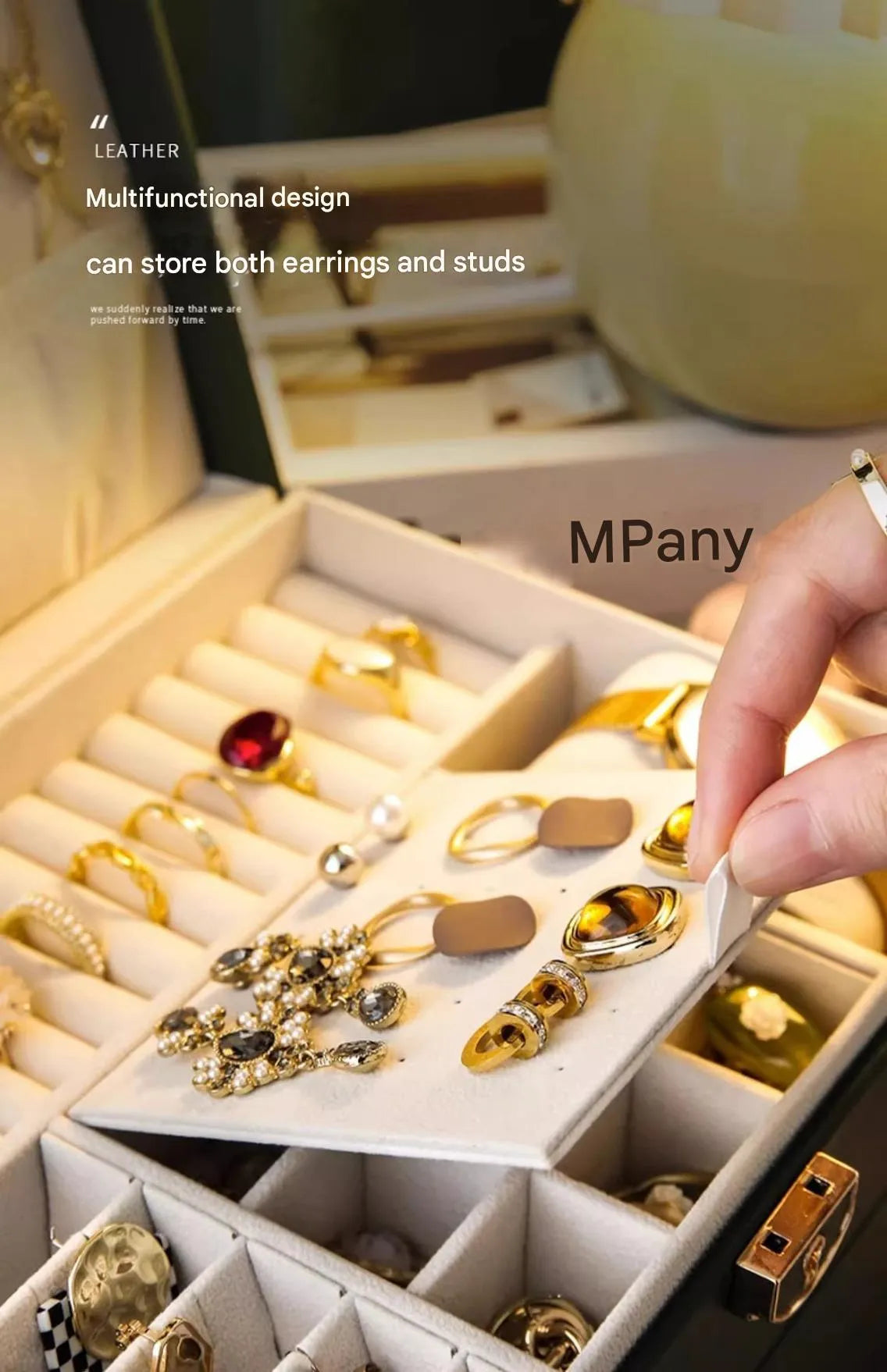 Leather jewellery box with three drawers open, showing storage for necklaces, earrings and bracelets.