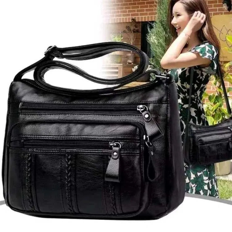 Black soft PU leather messenger bag with retro stitching and single shoulder strap