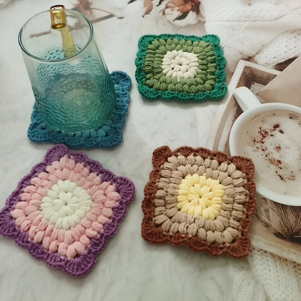 Crocheted wool cup placemat with Grandmother Lattice pattern in chosen colour