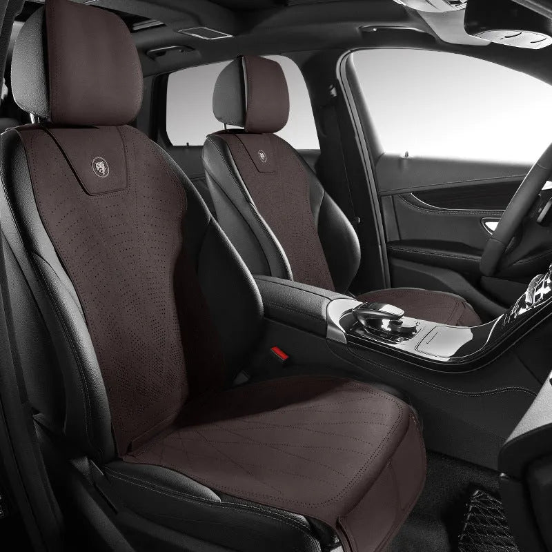 Ultra thin leather car seat cover with gradient drilling holes in Hermes Orange colour on a standard car seat.