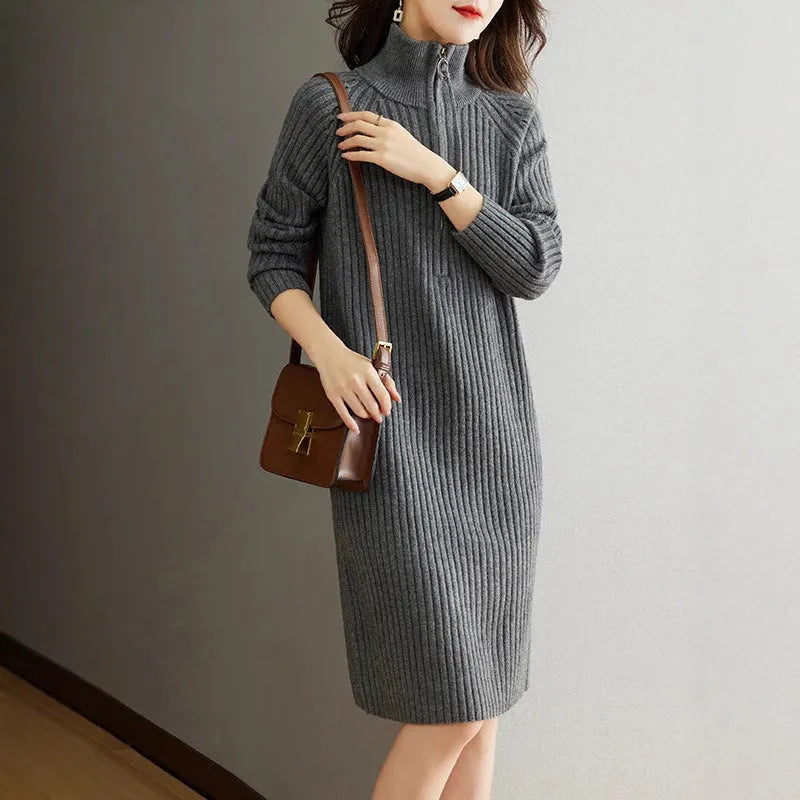 Beige half zip stand collar straight skirt with long sleeves on a mannequin