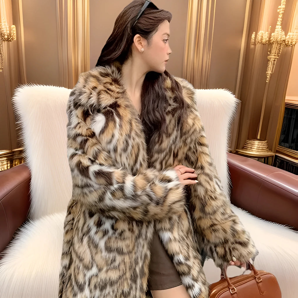 A person wearing a grey faux fur coat with a large fur collar and front pockets, in a street-fashion style.