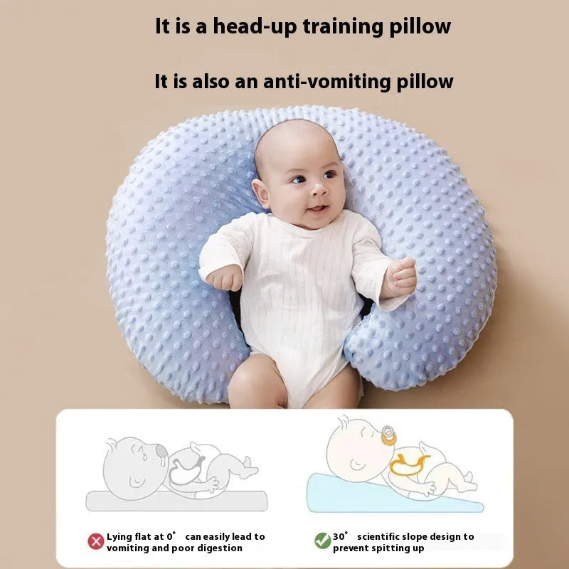 Gray U-shaped nursing pillow with removable cover on a neutral background.