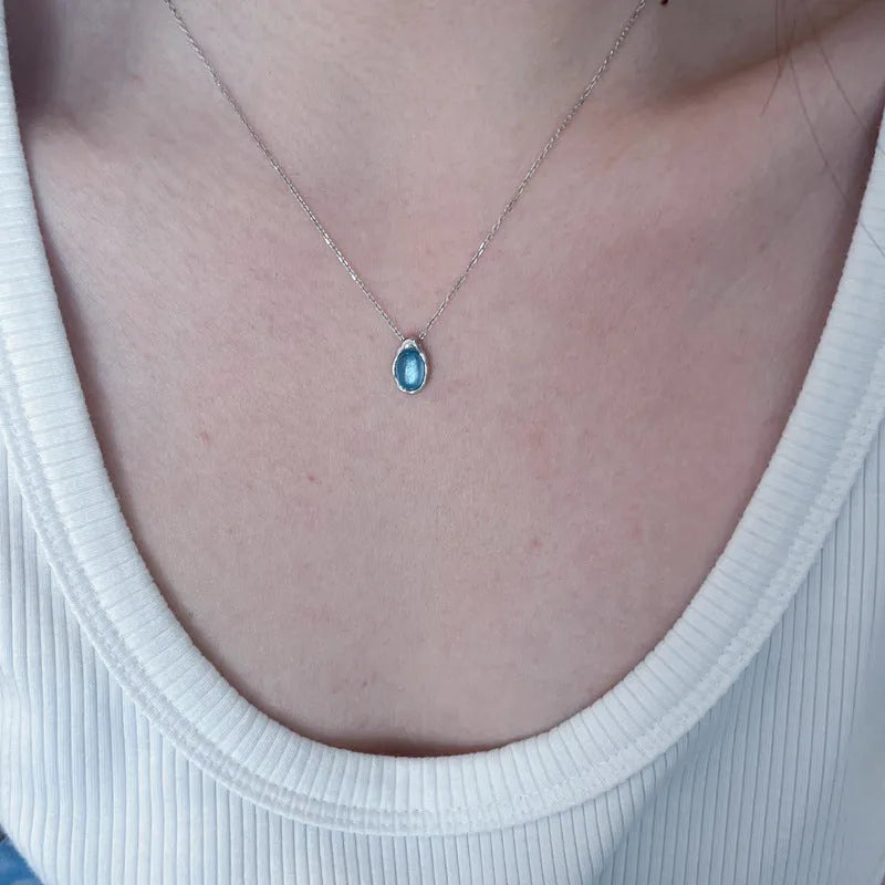 Navy blue water drop pendant copper necklace on woman with adjustable cross chain 41-50cm