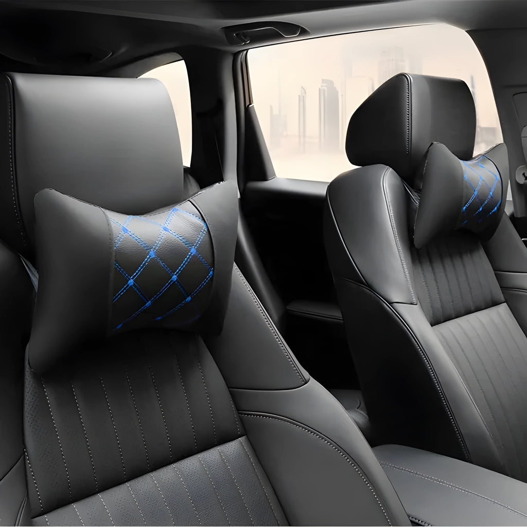 Black artificial leather car headrest pillow with quilted diamond pattern and coloured stitching.