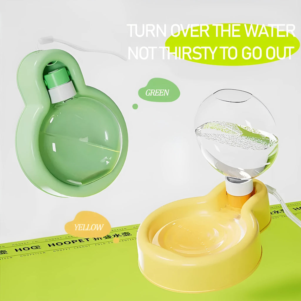Green portable dog travel water bottle and bowl dispenser on a table.