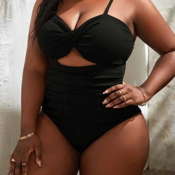 Plus size women's black slimming one-piece swimsuit with triangle sling and sleeveless design, sizes S-5XL