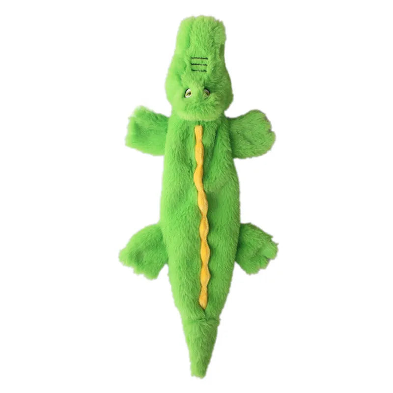Green crocodile-shaped plush dog toy with a squeaker and crinkle tail for aggressive chewers.