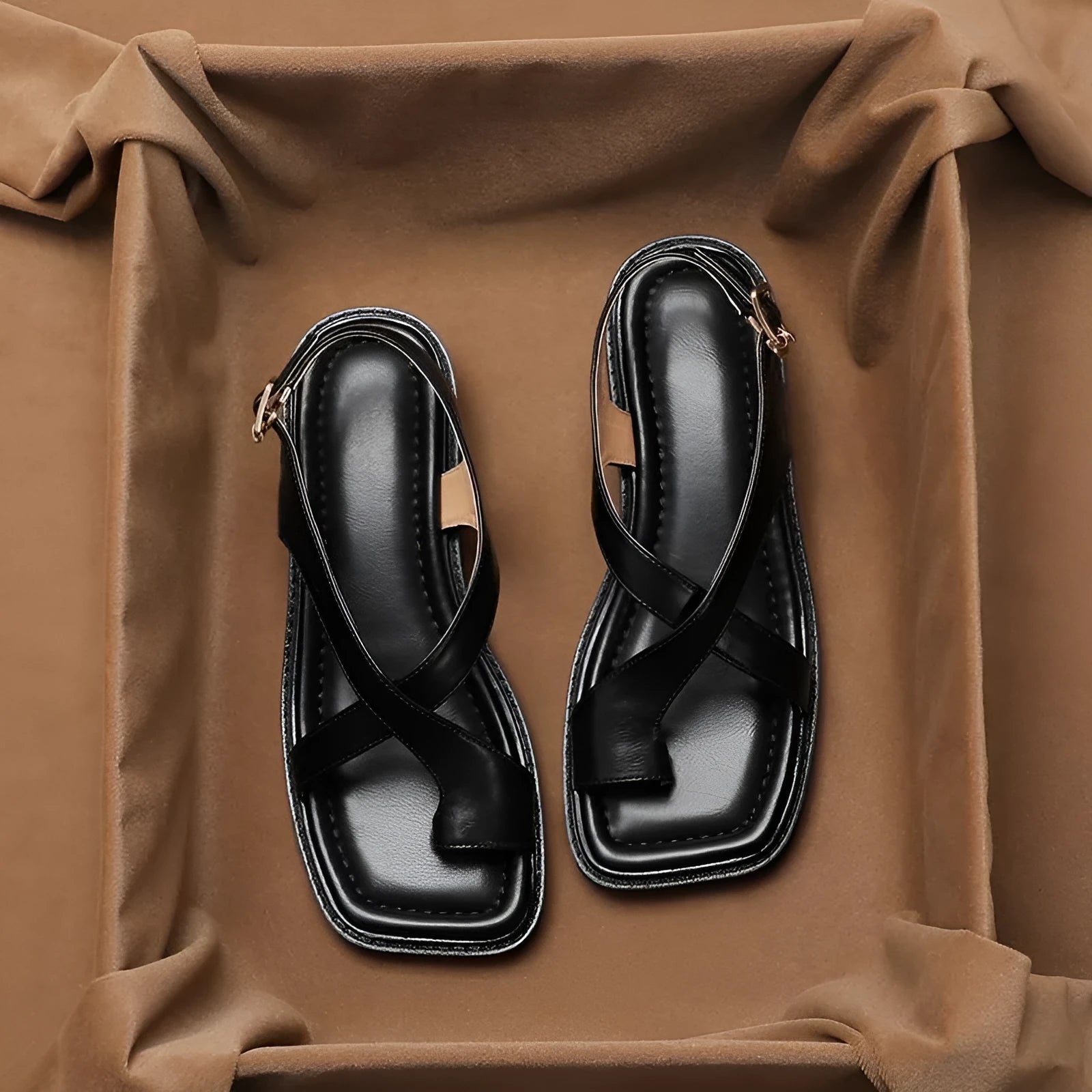 French retro brown toe ring sandals with square toe and ankle-strap buckle on a neutral background