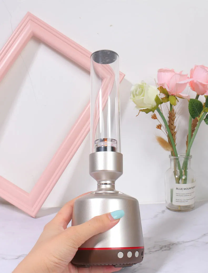 White silver candlelight Bluetooth speaker and LED night light with modern design.