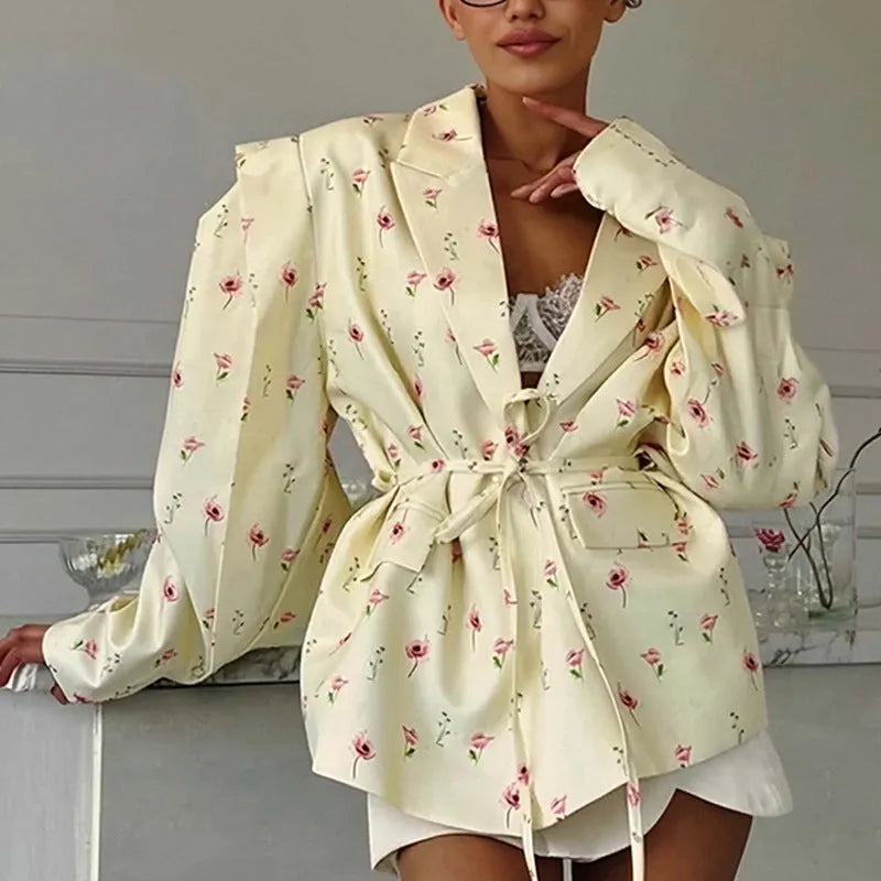Women's printed polyester jacket with a lace-up collar detail, shown in a floral design.