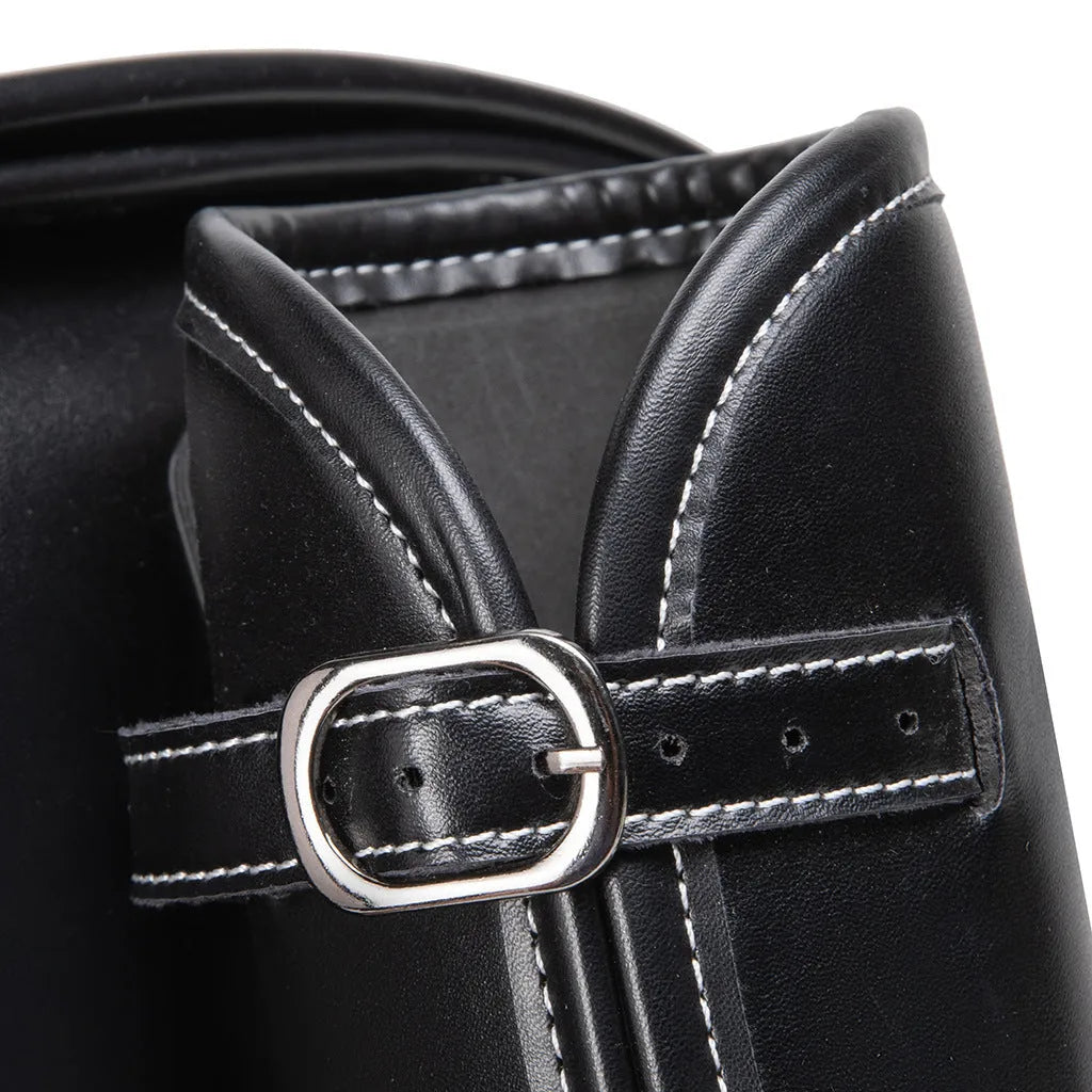 Single dark punk motorcycle side bag with a coded lock on a black background.