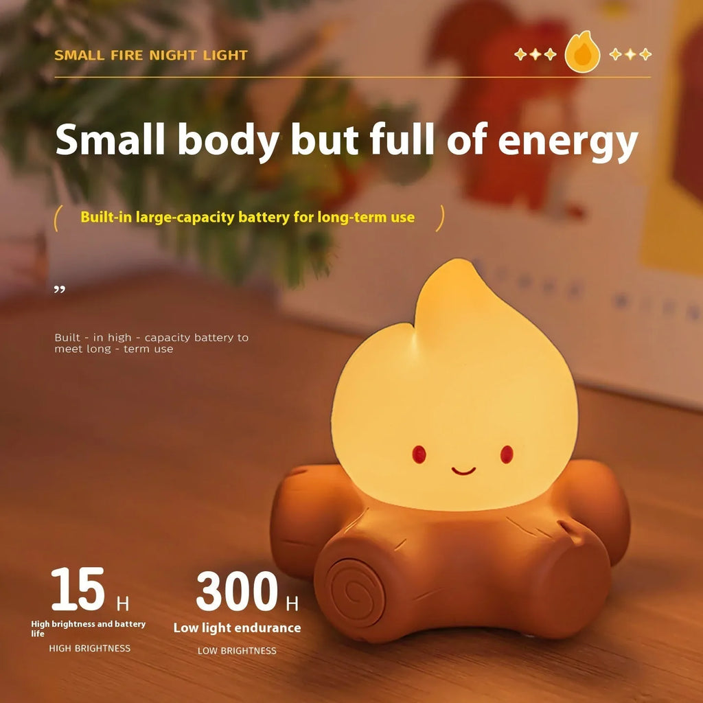 Small Fire Pile cartoon-style night lamp with yellow light on a surface.