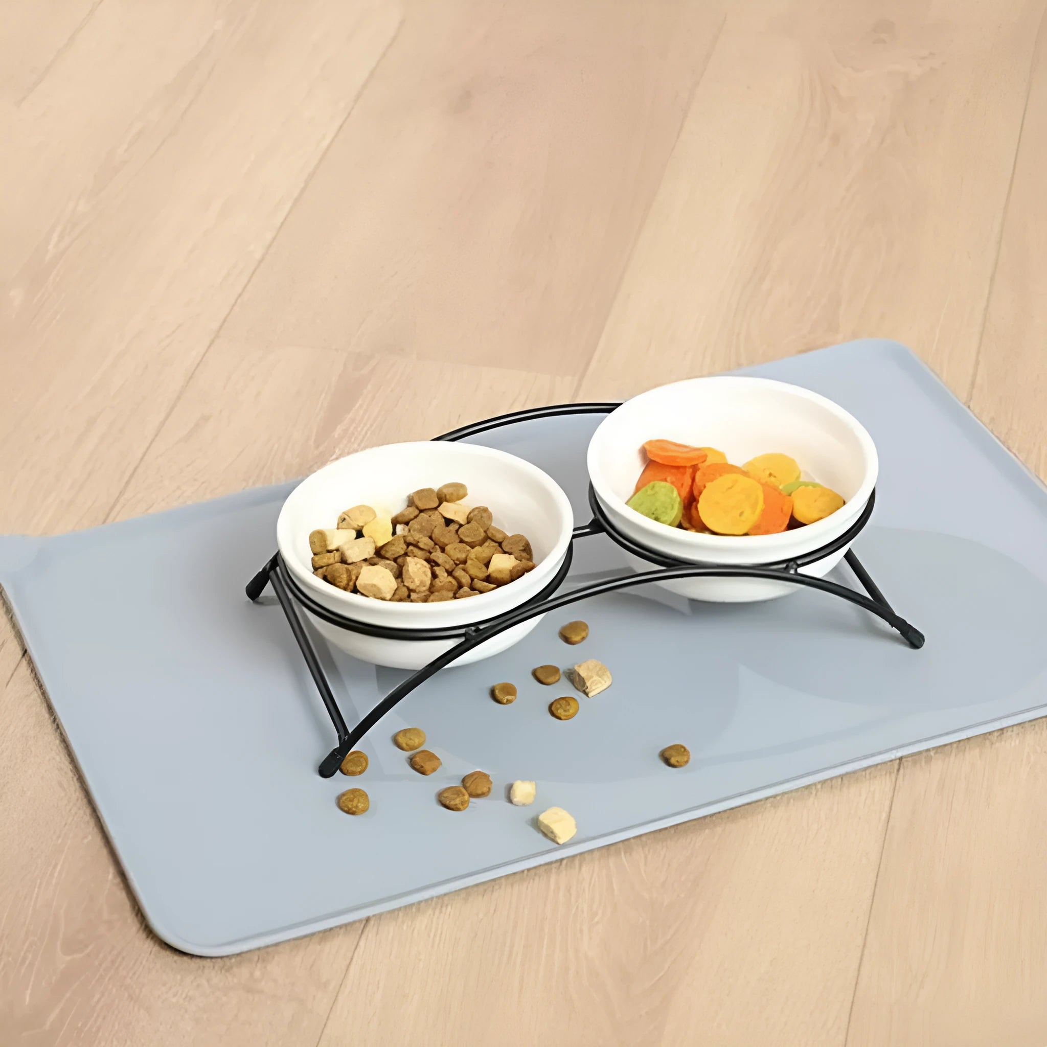 Silicone pet placemat in grey colour under a dog food bowl, showing raised edge.
