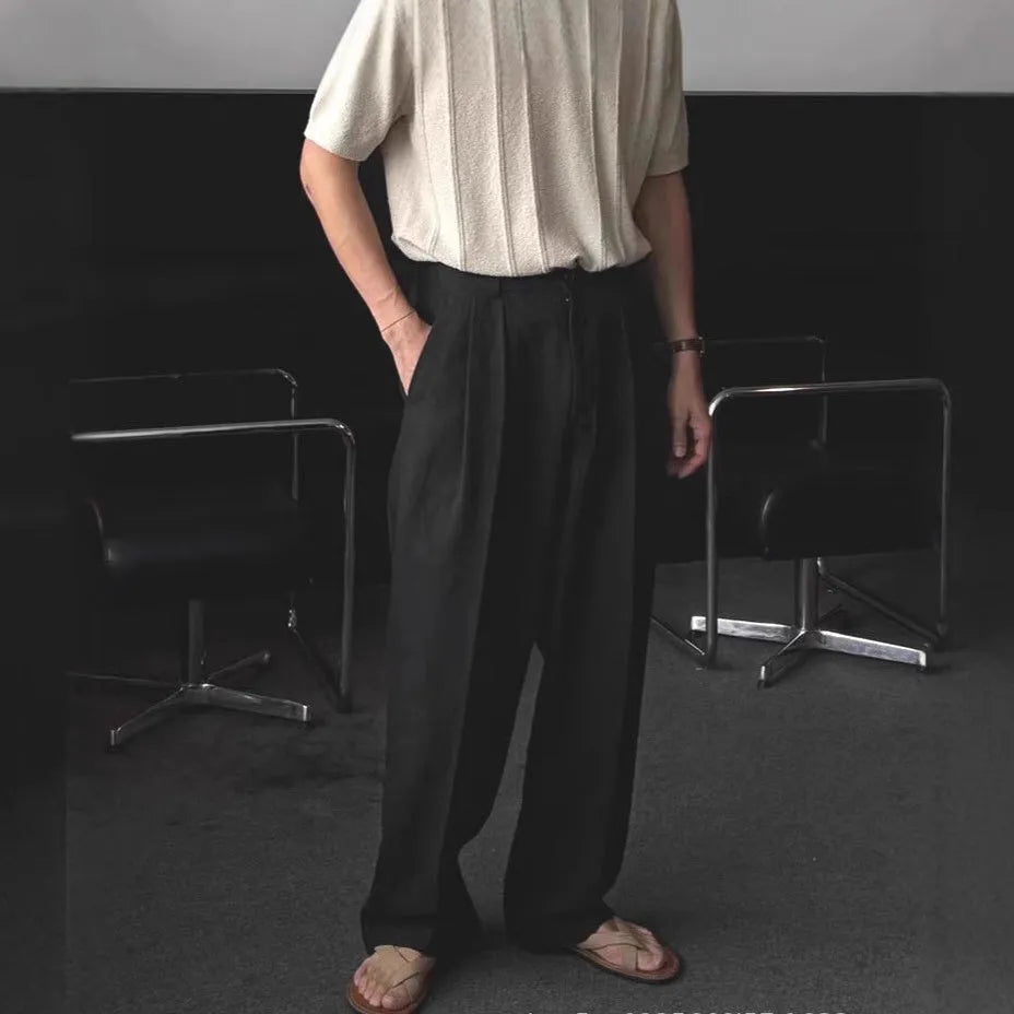 Men's loose-fit apricot coloured cotton linen blend trousers with a straight leg and elastic waistband.