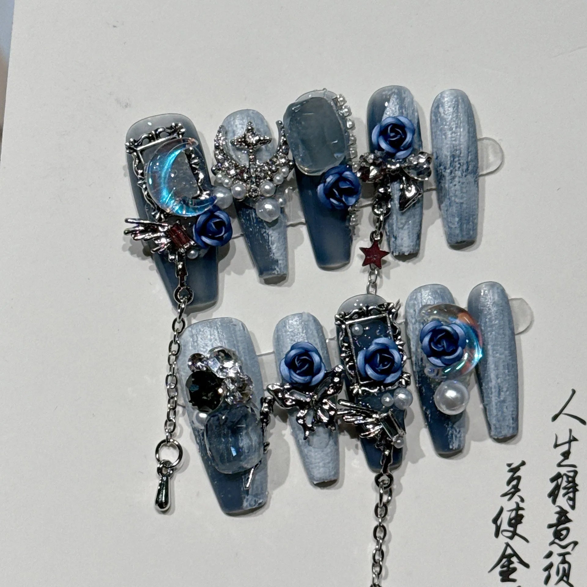 Evening manicure set with ornate rose pattern in heavy industry night blue colour