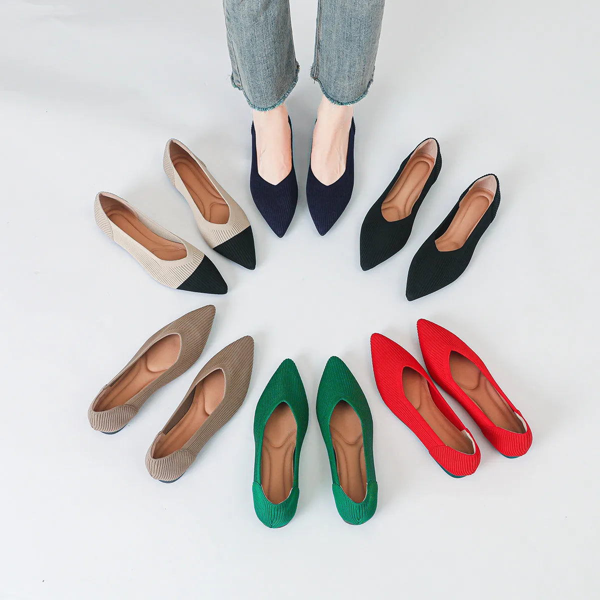 Women's apricot coloured knit flat pumps with a pointed toe and shallow mouth design on a plain background.